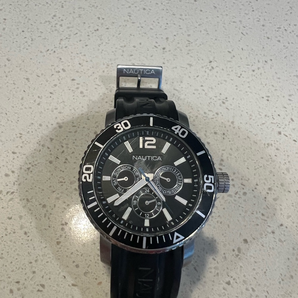 Nautical men’s watch, rubber adjustable band. Very good shape.